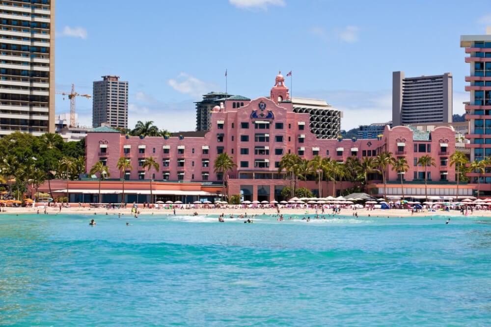Your Complete Family Guide to Oahu with Kids featured by top Hawaii travel blog, Hawaii Travel with Kids: The Royal Hawaiian is the iconic pink hotel right on Waikiki Beach