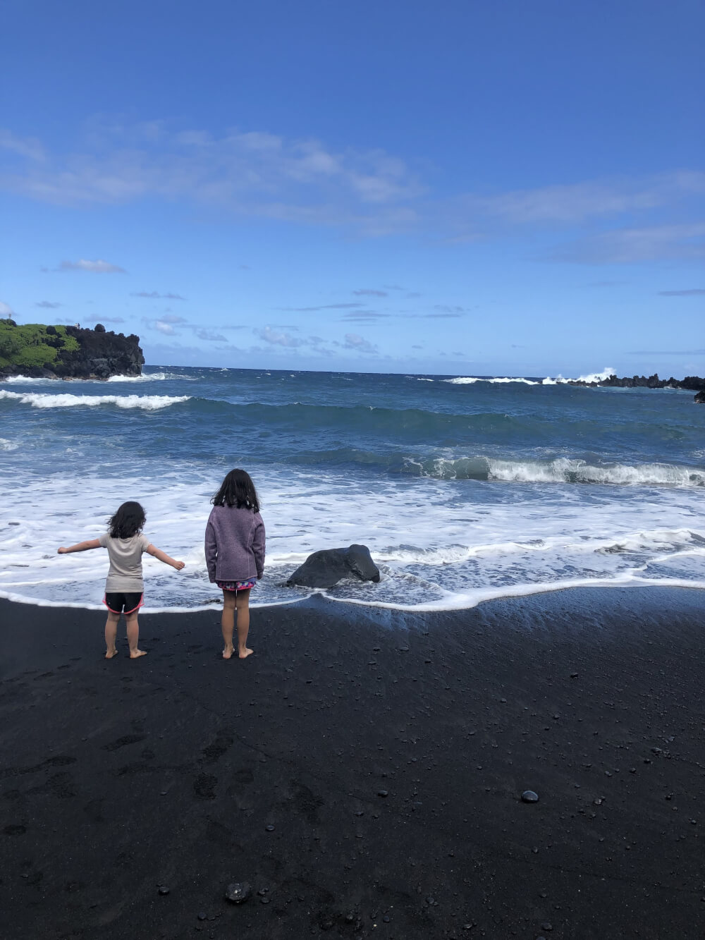 3 Day Maui Itinerary with Kids featured by top Hawaii travel blog, Hawaii Travel with Kids: Black Sand Beach, Wai’anapanapa State Park, Maui is great stop on the Road to Hana on Maui with kids