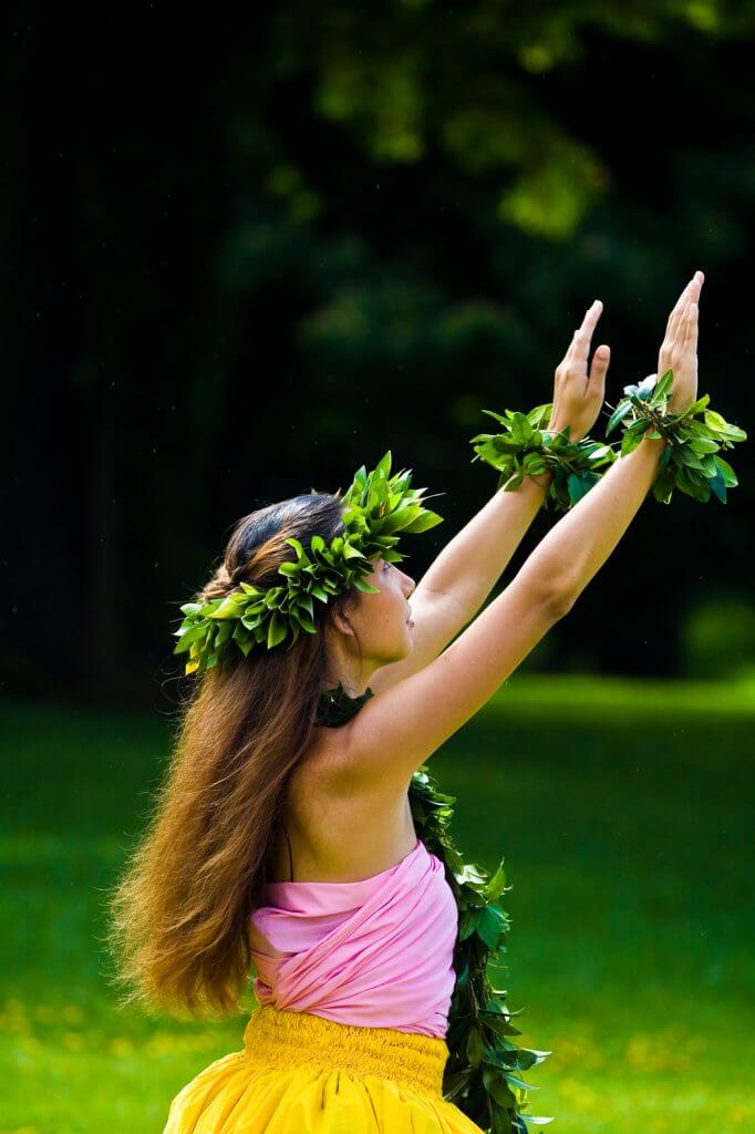 Another fun fact about Hawaii is that women weren't allowed to dance hula originally. Image of a woman hula dancing on Kauai.