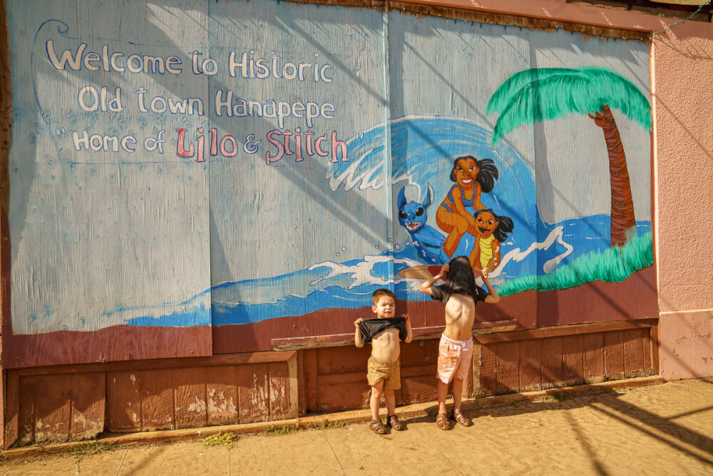 The Best 21 Free Things to do on Kauai with Kids featured by top Hawaii travel blog, Hawaii Travel with Kids: Kids will love checking out all the art in Hanapepe, especially the Lilo & Stitch wall!