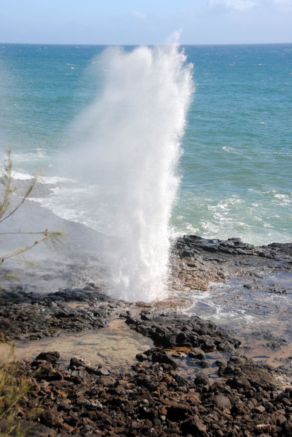 Oahu or Kauai: Which is the Best Hawaiian Island for Kids? Tips featured by top Hawaii travel blog, Hawaii Travel with Kids: Spouting Horn in Poipu is an awesome free thing to do on Kauai with kids