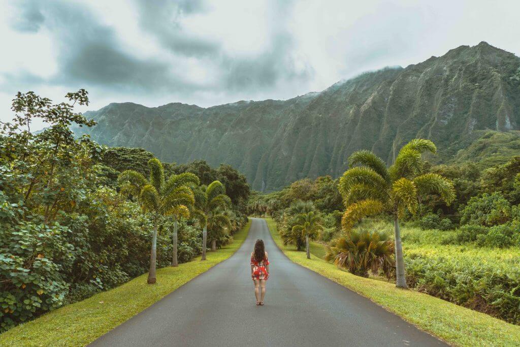 Find out the most beautiful Hawaii botanical gardens recommended by top Hawaii blog Hawaii Travel with Kids. Image of a woman at Ho'omaluhia Botanical Garden on Oahu.