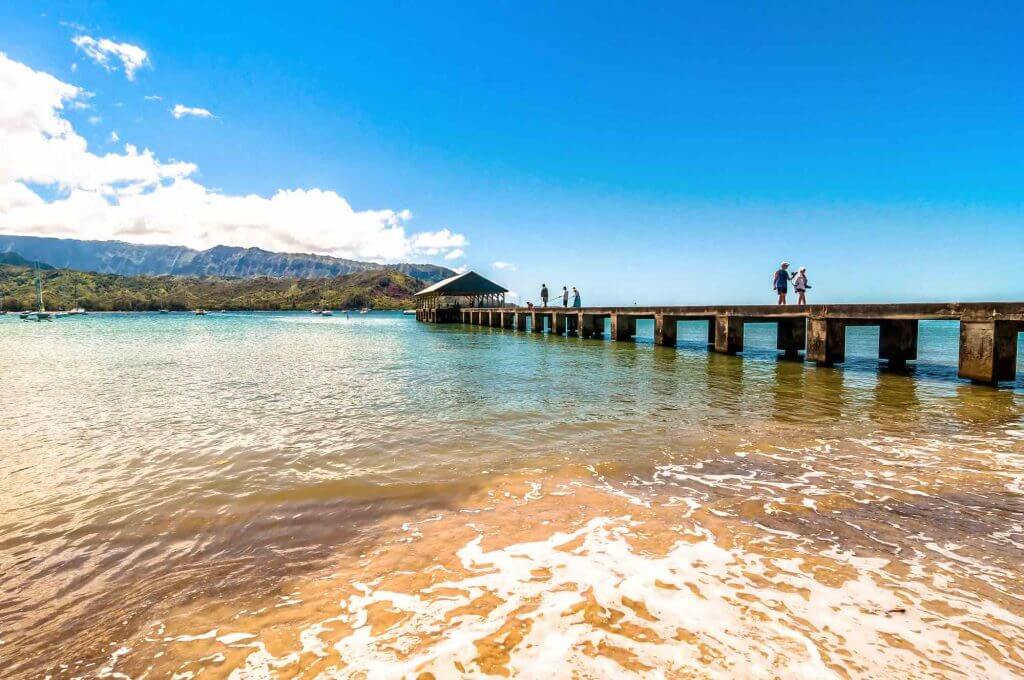 Hanalei Bay is a popular North Shore Kauai snorkeling beach. Image of Hanalei Pier on Kauai.