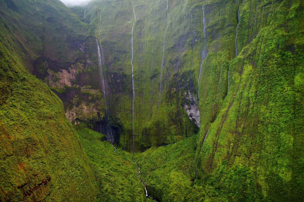 Top 11 Best Kauai Waterfalls you Should Visit featured by top Hawaii travel blog, Hawaii Travel with Kids: Mount Waialeale known as the wettest spot on Earth, Kauai, Hawaii