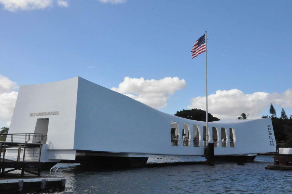 You can visit Pearl Harbor for free and it's a top thing to do on a military vacation to Hawaii. Image of the U.S.S. Arizona Memorial at Pearl Harbor.