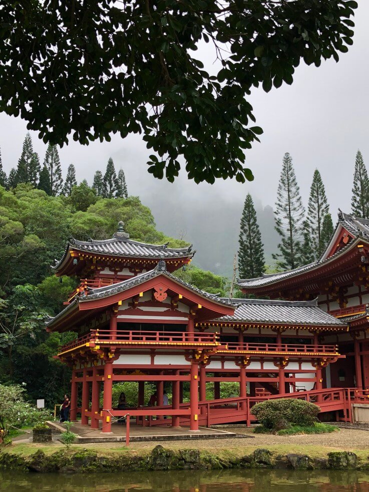 The Most Beautiful Places To Visit In Oahu featured by top Hawaii travel blog, Hawaii Travel with Kids: The Byodo-In Temple is a popular Oahu photography spot.