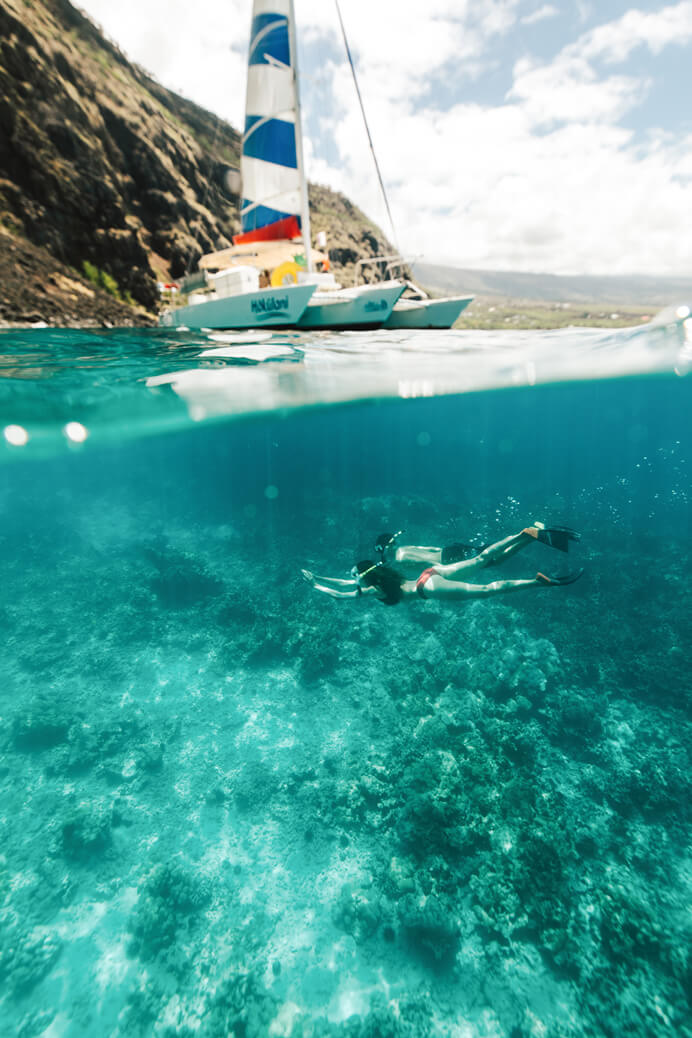 Best Places for Kayaking in Hawaii featured by top Hawaii blogger, Hawaii Travel with Kids: Snorkelers exploring Kealakekua Bay, Big Island