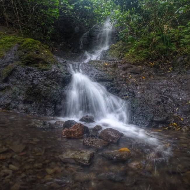 12 Breathtaking Oahu Waterfall Hikes featured by top Hawaii travel blog, Hawaii Travel with Kids | Likeke Falls is a two tiered waterfall on Oahu