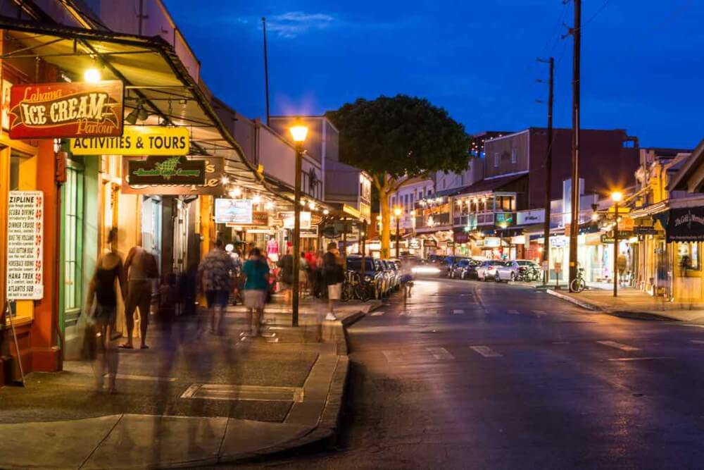 Things to do in Lahaina Maui featured by top Hawaii blog, Hawaii Travel with Kids: Front Street at nighttime, which is a vibrant part of Lahaina