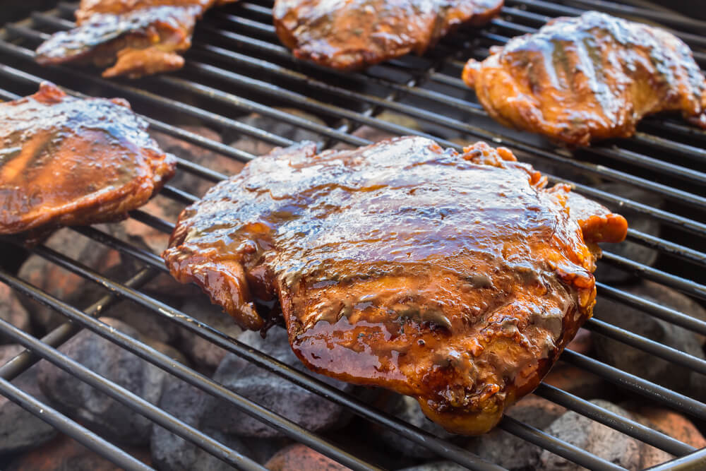 Hawaii Vacation Condo vs Hotel pros and cons featured by top Hawaii blog, Hawaii Travel with Kids: Grilled boneless chicken thighs marinated and basted in a mixture of guava jam, shoyu, oyster sauce and seasonings