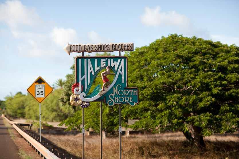 50 Best Places to Visit in Hawaii with your Family featured by top Hawaii blog, Hawaii Travel with Kids: Nothing is more iconic that this Haleiwa sign as you enter North Shore Oahu