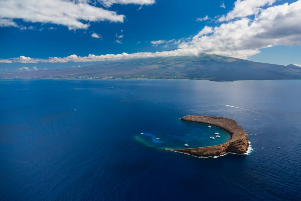 Best Snorkeling in Maui featured by top Hawaii blog, Hawaii Travel with Kids: Molokini Crater, Maui snorkeling spot