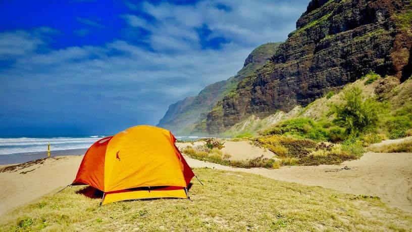 Guide to Camping in Hawaii featured by top Hawaii blog, Hawaii Travel with Kids. | Camping in Hawaii can be really cheap, if you know where to stay, like at the Na Pali Coast on Kauai