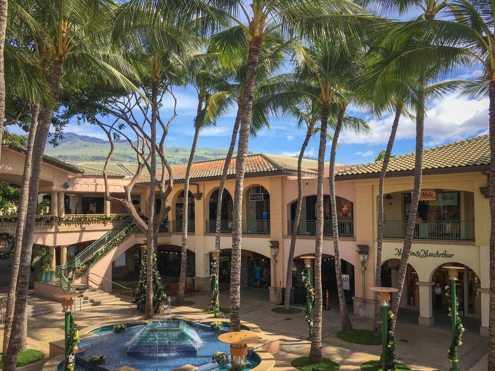 21 Best Things to Do in Wailea Maui featured by top Hawaii blog, Hawaii Travel with Kids: Shops at Wailea on Maui.Image of an outdoor shopping mall with 2 stories.