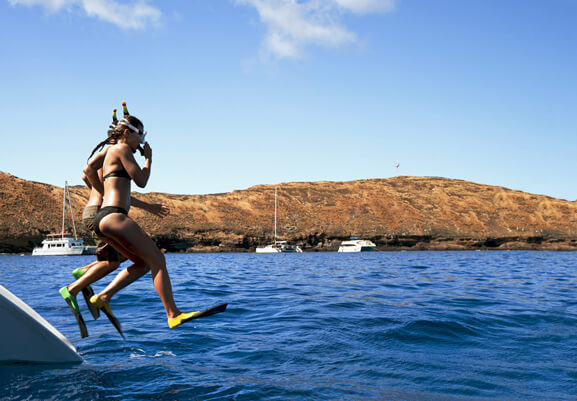 Exploring Molokini Crater in Maui, a guide featured by top Hawaii blog, Hawaii Travel with Kids: Snorkelers at Molokini Crater near Maui