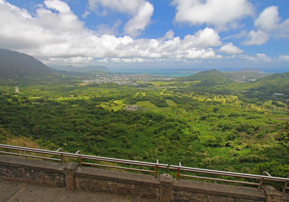 17 Historical Places in Hawaii to Visit with Kids featured by top Hawaii blog, Hawaii Travel with Kids: View of the windward coastline of Oahu, Hawaii, from the Nuuanu Pali Lookout in the mountains above Honolulu