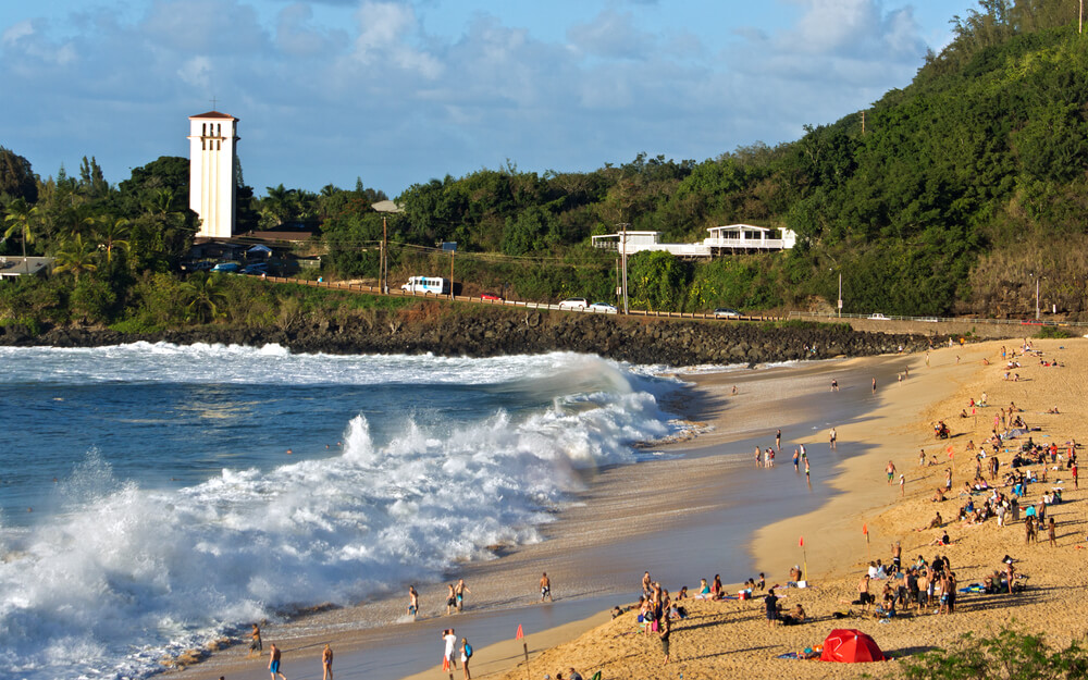 Oahu Surfing On The North Shore, a complete guide featured by top Hawaii blog, Hawaii Travel with Kids: View of Waimea Bay on the North Shore of Oahu.