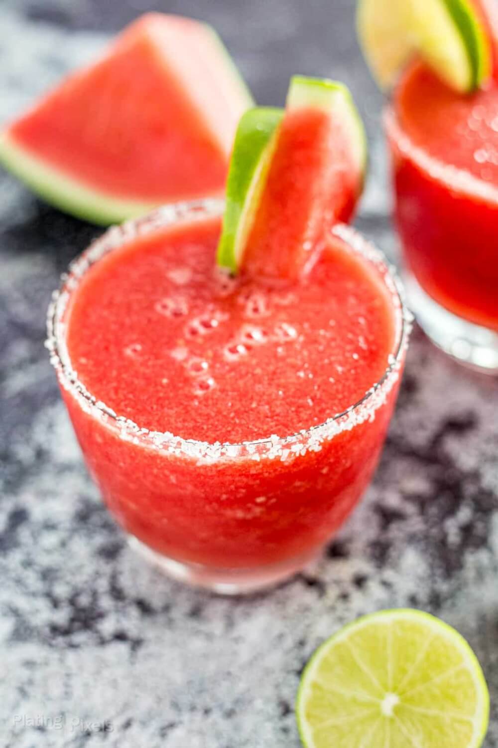 40 Hawaiian Cocktails To Try At Home featured by top Hawaii blog, Hawaii Travel with Kids: Close up shot of a Frozen Watermelon Margarita