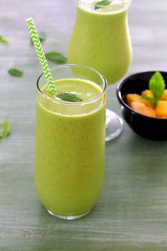 Hawaiian Tropical Smoothie Recipes to Make at Home featured by top Hawaii blog, Hawaii Travel with Kids: Mango green smoothie recipe | Mango coconut smoothie with spinach