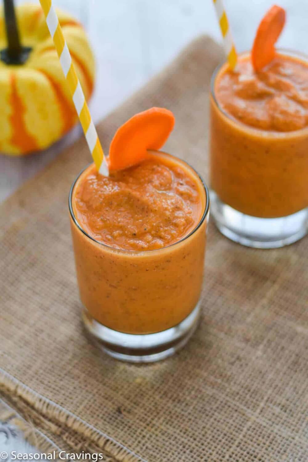 Hawaiian Tropical Smoothie Recipes to Make at Home featured by top Hawaii blog, Hawaii Travel with Kids: Mango Carrot Chia Smoothie fresh, healthy and delicious breakfast with straw and carrot garnish