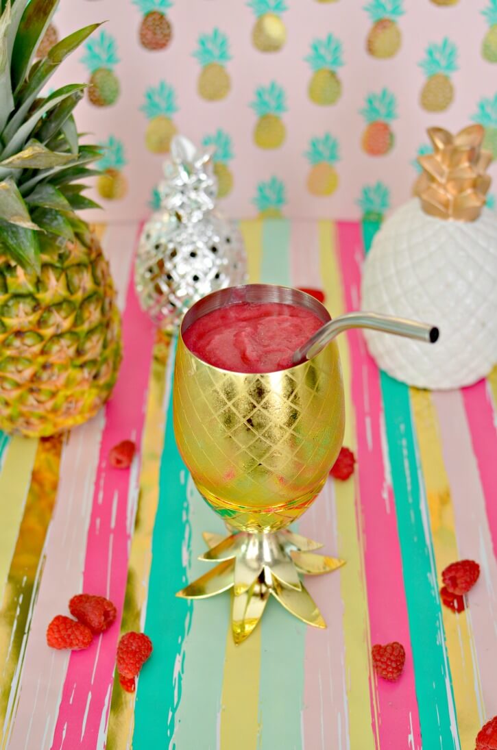 40 Hawaiian Cocktails To Try At Home featured by top Hawaii blog, Hawaii Travel with Kids: Pineapple Raspberry Slushie Cocktail