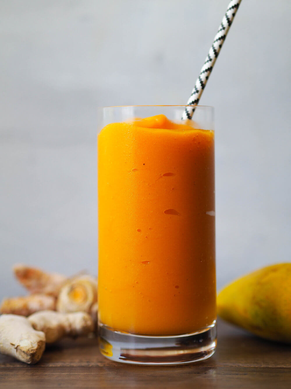 Hawaiian Tropical Smoothie Recipes to Make at Home featured by top Hawaii blog, Hawaii Travel with Kids: This turmeric mango smoothie is creamy and refreshing! Blended with coconut water so it's extra hydrating! #summer #smoothie #mango #turmeric #healthyrecipe #vegan #vegetarian