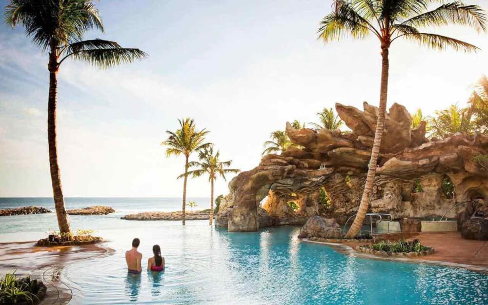 Top 8 Romantic Oahu Honeymoon Resorts featured by top Hawaii blog, Hawaii Travel with Kids: Aulani Resort swimming pool