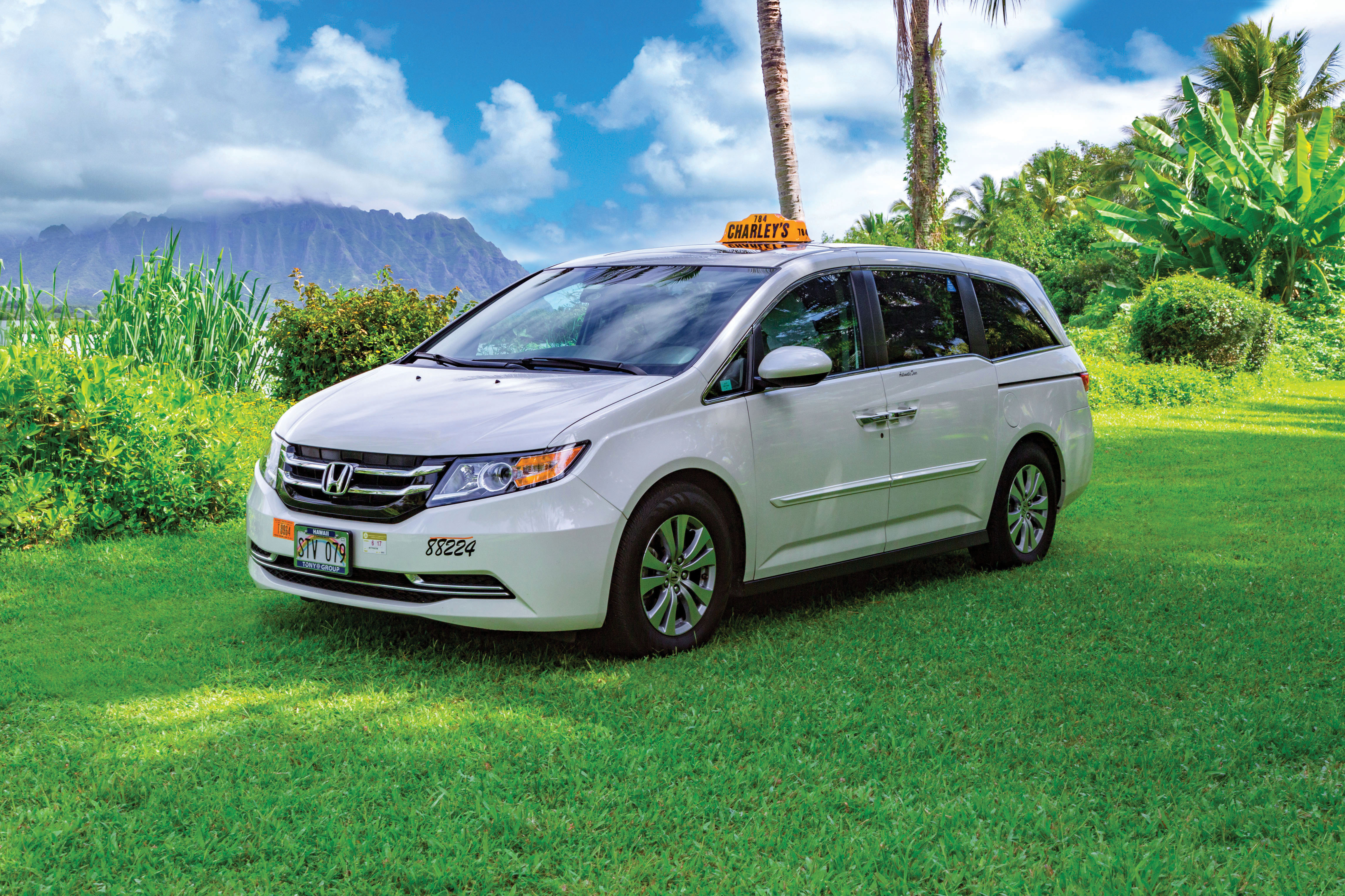 How to Get from Honolulu Airport to Waikiki Easily, tips featured by top Hawaii blog, Hawaii Travel with Kids: https://hawaiitravelwithkids.com/wp-content/uploads/2020/05/Charleys-Taxi-Honda-Odyssey-w-o-driver_160809-170_RGB.jpg