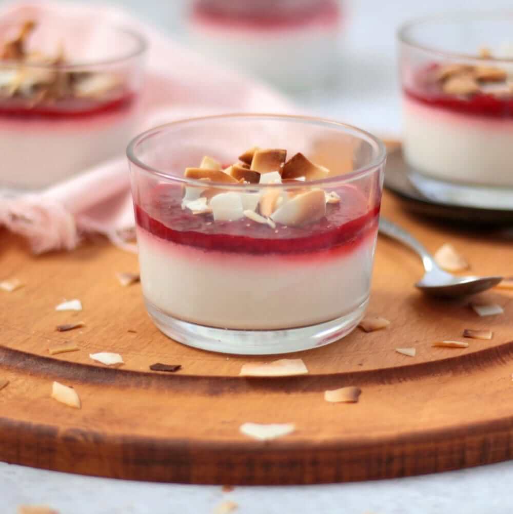 61 Delicious Coconut Dessert Recipes Perfect for Summer featured by top Hawaii blog, Hawaii Travel with Kids: Close up on the Vegan Panna Cotta on a wooden board