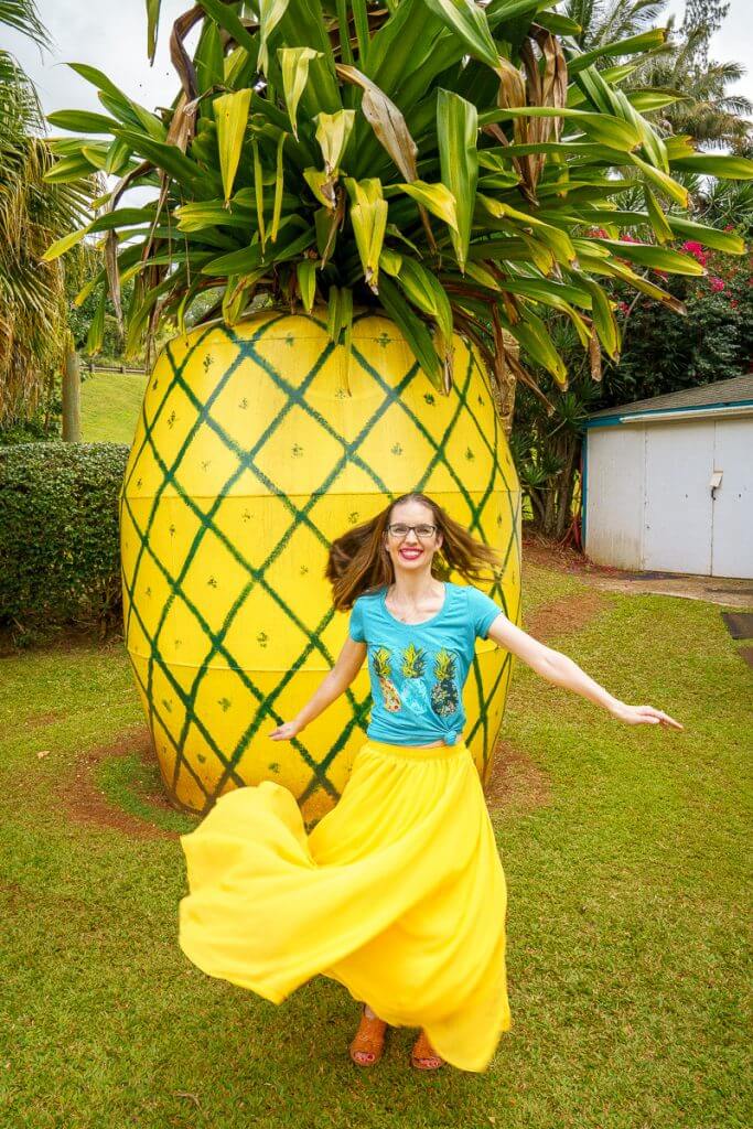 Top 12 Best Photo Opportunities on Kauai featured by top Hawaii travel blog, Hawaii Travel with Kids: One of the best photo opportunities on Kauai is this giant pineapple roadside attraction at the Kauai Trading Post in Lawai.