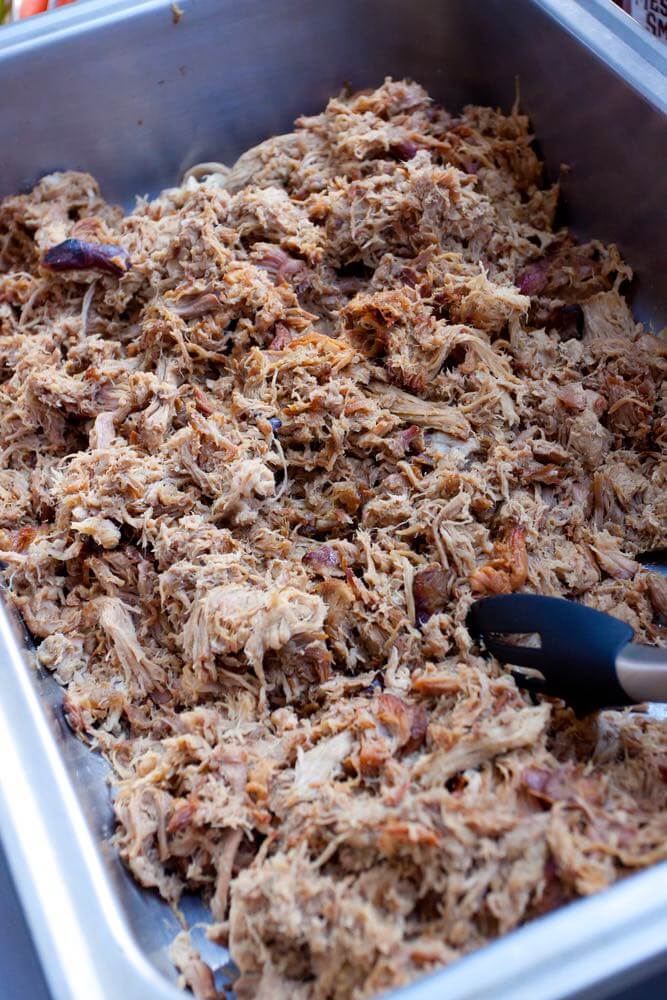 Traditional Hawaiian Food and Dishes to try featured by top Hawaii blog, Hawaii Travel with Kids: Pulled pork at a buffet table during a wedding reception.