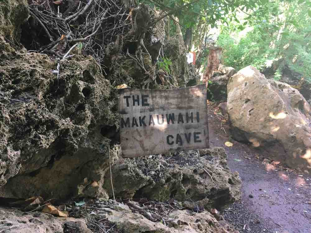 Top 25 Things to do in Poipu, Kauai featured by top Hawaii blog, Hawaii Travel with Kids: The Makauwahi Cave Sign in Poipu Kauai