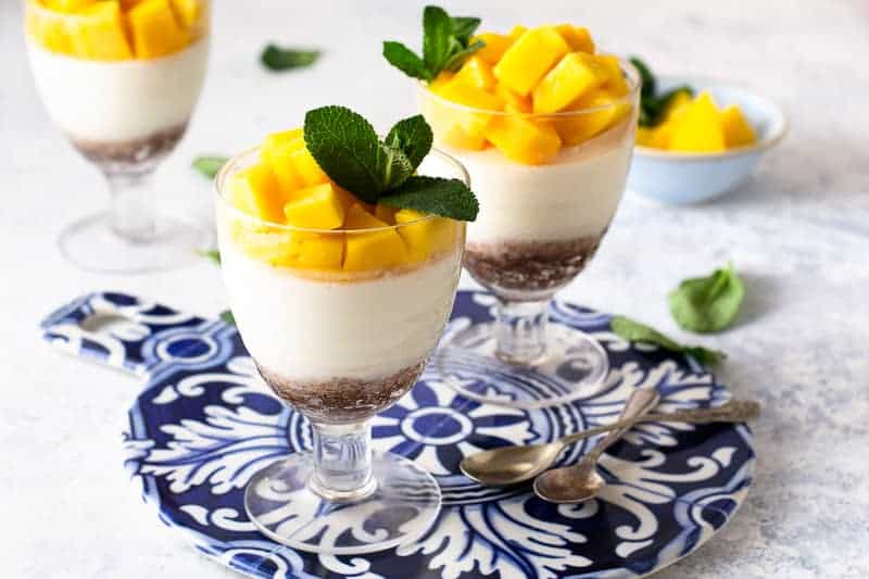 61 Delicious Coconut Dessert Recipes Perfect for Summer featured by top Hawaii blog, Hawaii Travel with Kids: Mango Coconut panna cotta with dates and walnuts