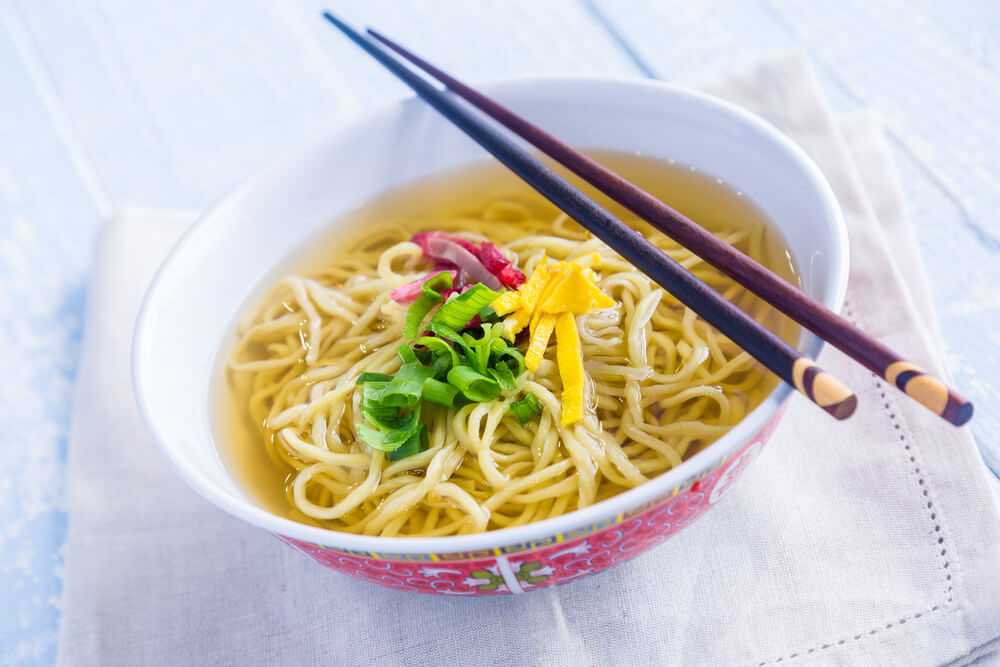 Classic saimin soup with char siu pork, egg and green onions