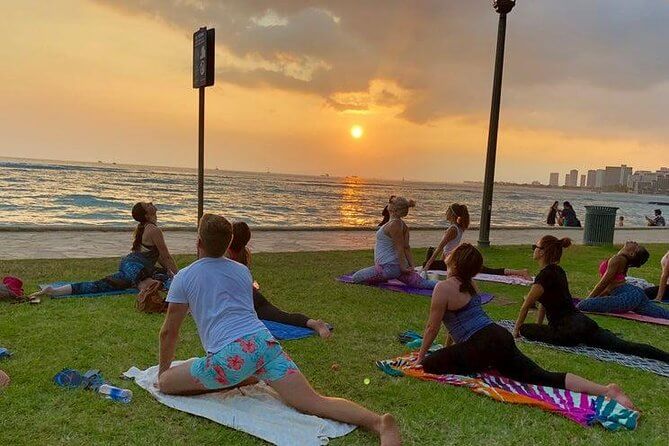 25 Amazing activities in Waikiki with kids featured by top Hawaii blog, Hawaii Travel with Kids: Sunset Yoga Class in Waikiki.