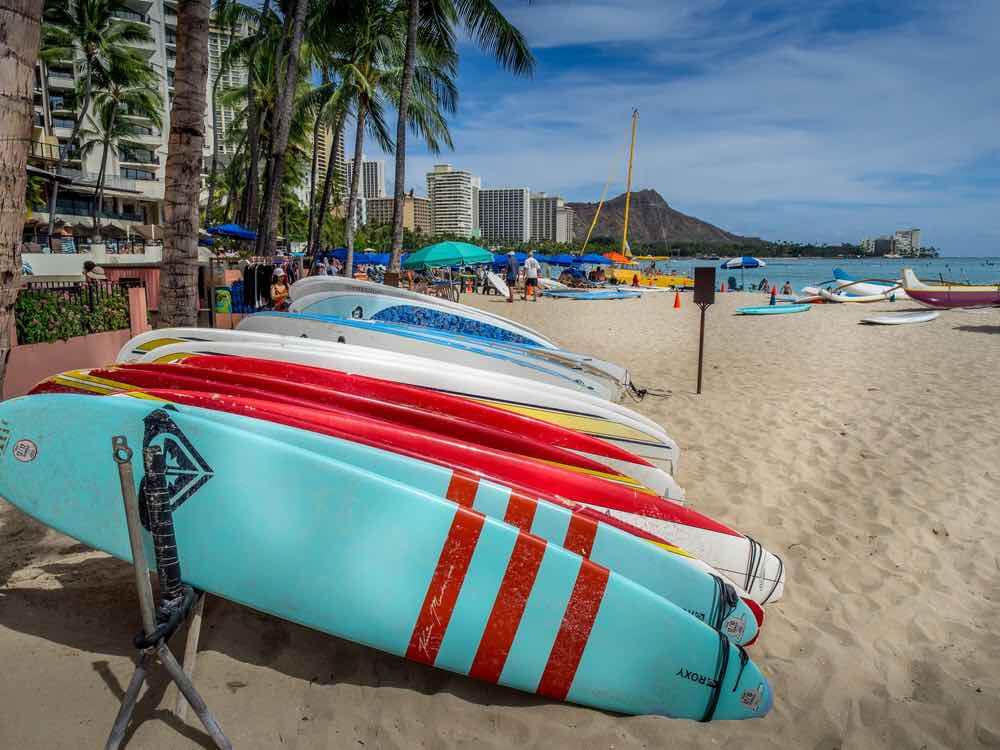 Is Oahu the best Hawaiian island for kids? Image of surfboards on Waikiki Beach with view of Diamond Head