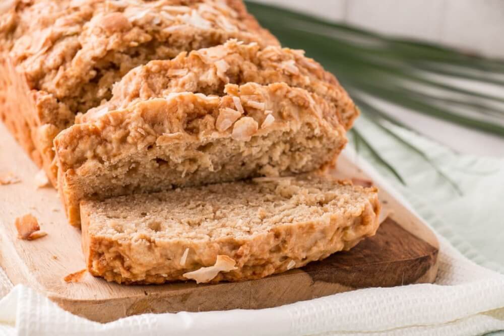 61 Delicious Coconut Dessert Recipes Perfect for Summer featured by top Hawaii blog, Hawaii Travel with Kids: This Coconut Lime Loaf is a one bowl easy to prepare quick bread. Brighten up your day with this vibrant Coconut Lime Loaf! #coconut #lime #easyrecipe #comfortfood