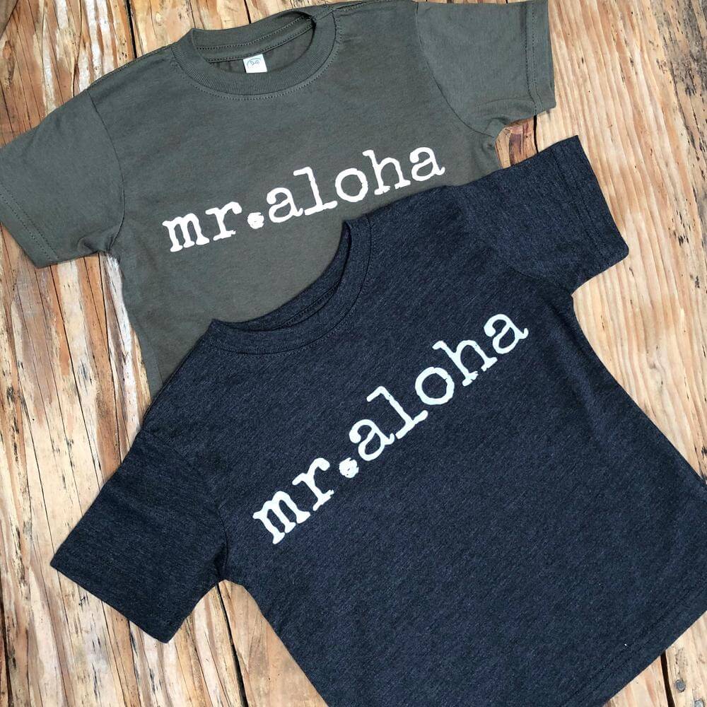 Top 15 Best Kauai Souvenirs featured by top Hawaii blog, Hawaii Travel with Kids: Ivy & Co. printed shirts that say "Mr. Aloha" on them