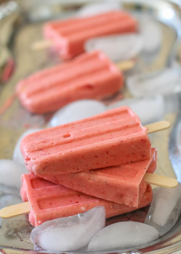 61 Delicious Coconut Dessert Recipes Perfect for Summer featured by top Hawaii blog, Hawaii Travel with Kids: Strawberry Coconut Milk Popsicles - naturally sweetened, dairy-free, vegan, and paleo! #dessert #recipe TheRoastedRoot.net