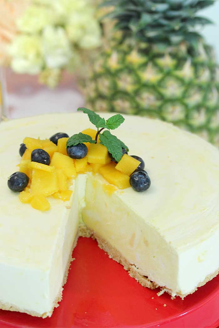 Pineapple Dessert Recipe Roundup by top Hawaii blog Hawaii Travel with Kids: Mango Pineapple Icebox Cheesecake closeup without slice
