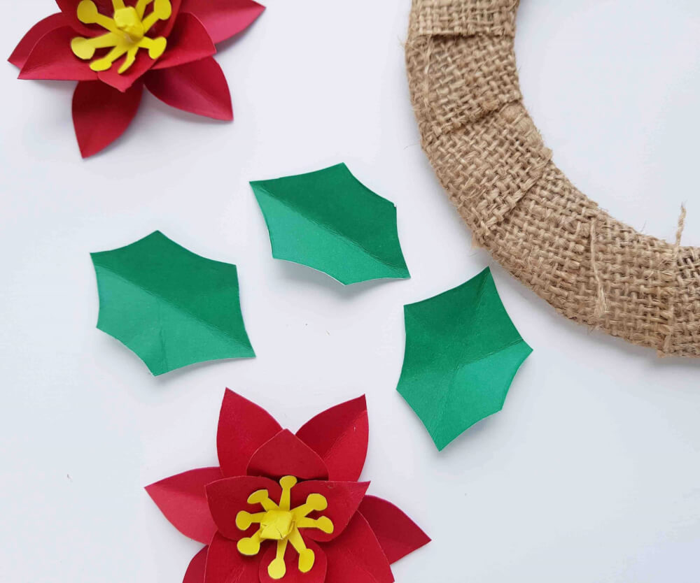 Hawaiian Christmas Decorations: How to Make a Poinsettia Wreath, a step by step tutorial featured by top Hawaii blog, Hawaii Travel with Kids.