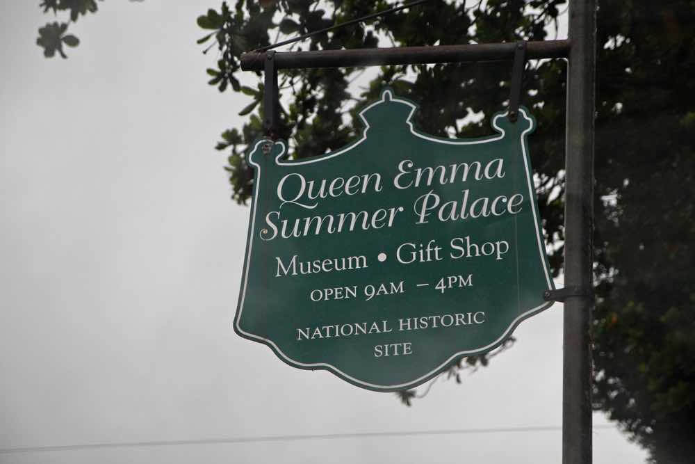 17 Historical Places in Hawaii to Visit with Kids featured by top Hawaii blog, Hawaii Travel with Kids: Honolulu, Hawaii-September 2015: Sign outside the Queen Emma Summer Palace museum and gift shop, a National Historic Site in Honolulu.