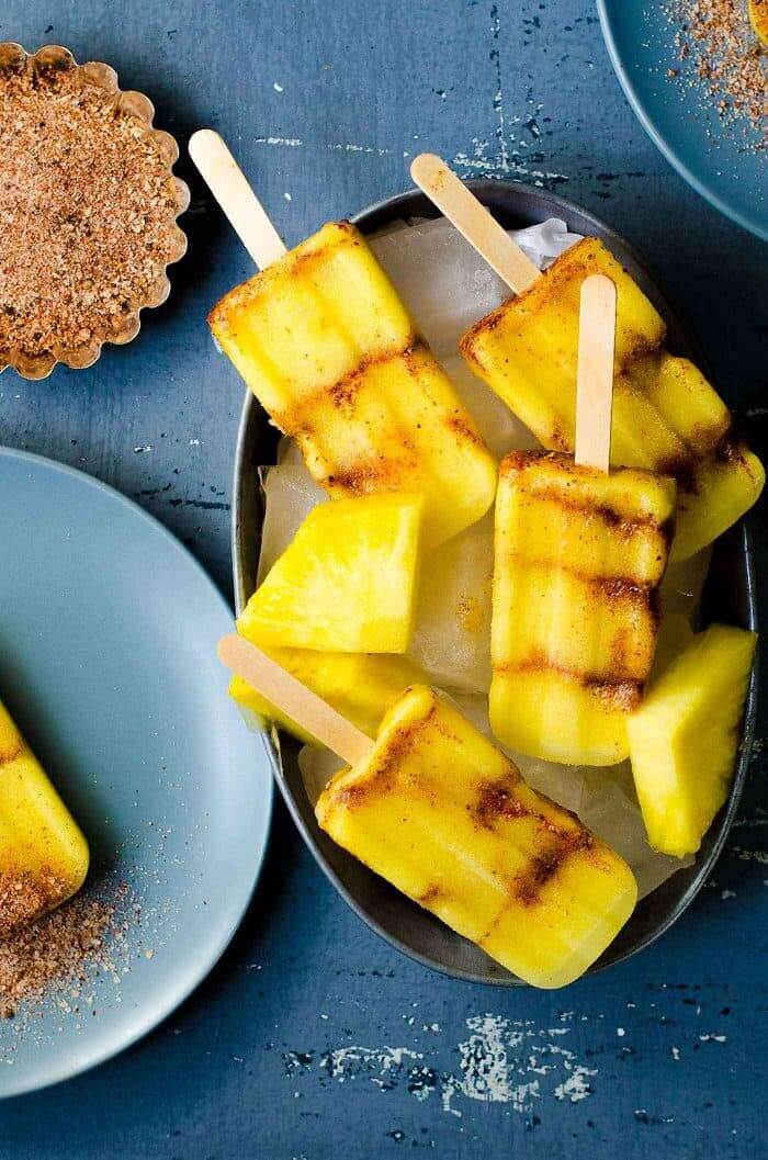 Pineapple Dessert Recipe Roundup by top Hawaii blog Hawaii Travel with Kids: Spicy Pineapple Popsicles (Paletas) - layered with a spicy, salty spice mix that enhances the fruity freshness and sweetness even more! 