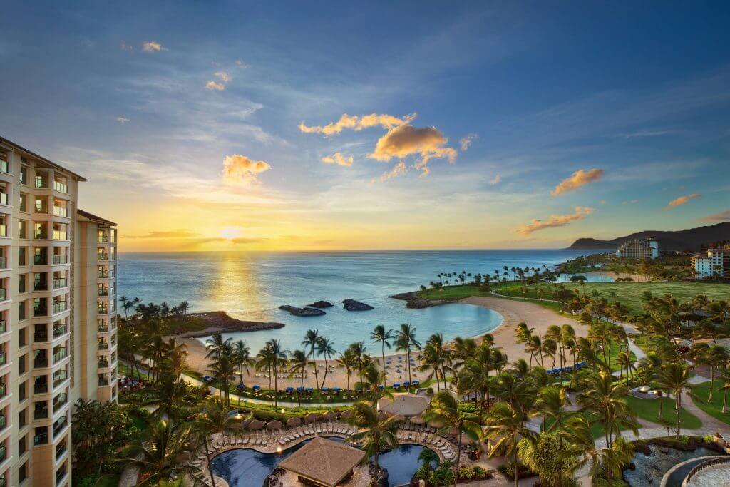 The Marriott Ko Olina Beach Club is one of the best family friendly resorts in Hawaii. Image of sunset over the beach area at an Oahu resort for kids.