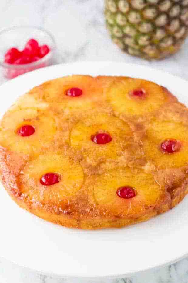 Pineapple Dessert Recipe Roundup by top Hawaii blog Hawaii Travel with Kids: pineapple upside down cake on a white plate