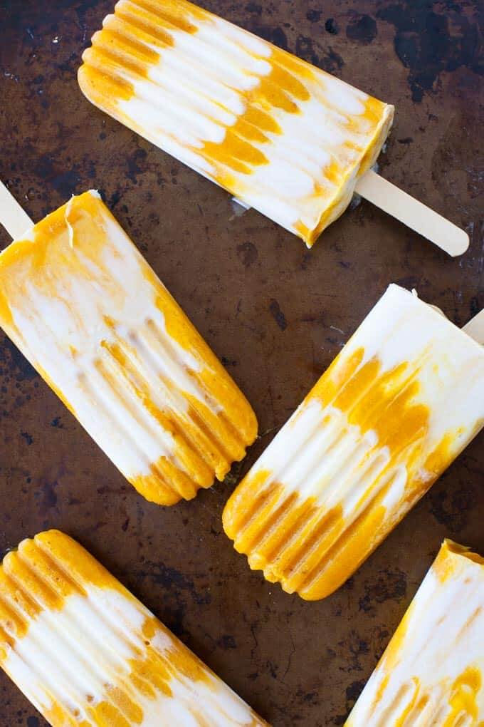 Best Mango dessert recipes by top Hawaii blog Hawaii Travel with Kids: Sweet and creamy, these mango turmeric lassi popsicles are the perfect antioxidant-packed dessert.