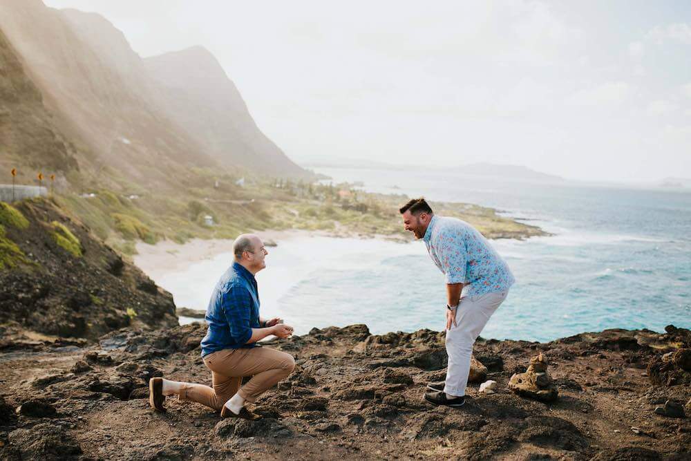 Hire a Hawaii vacation photographer for your Hawaii beach proposal. Image of a proposal on a beach in Hawaii