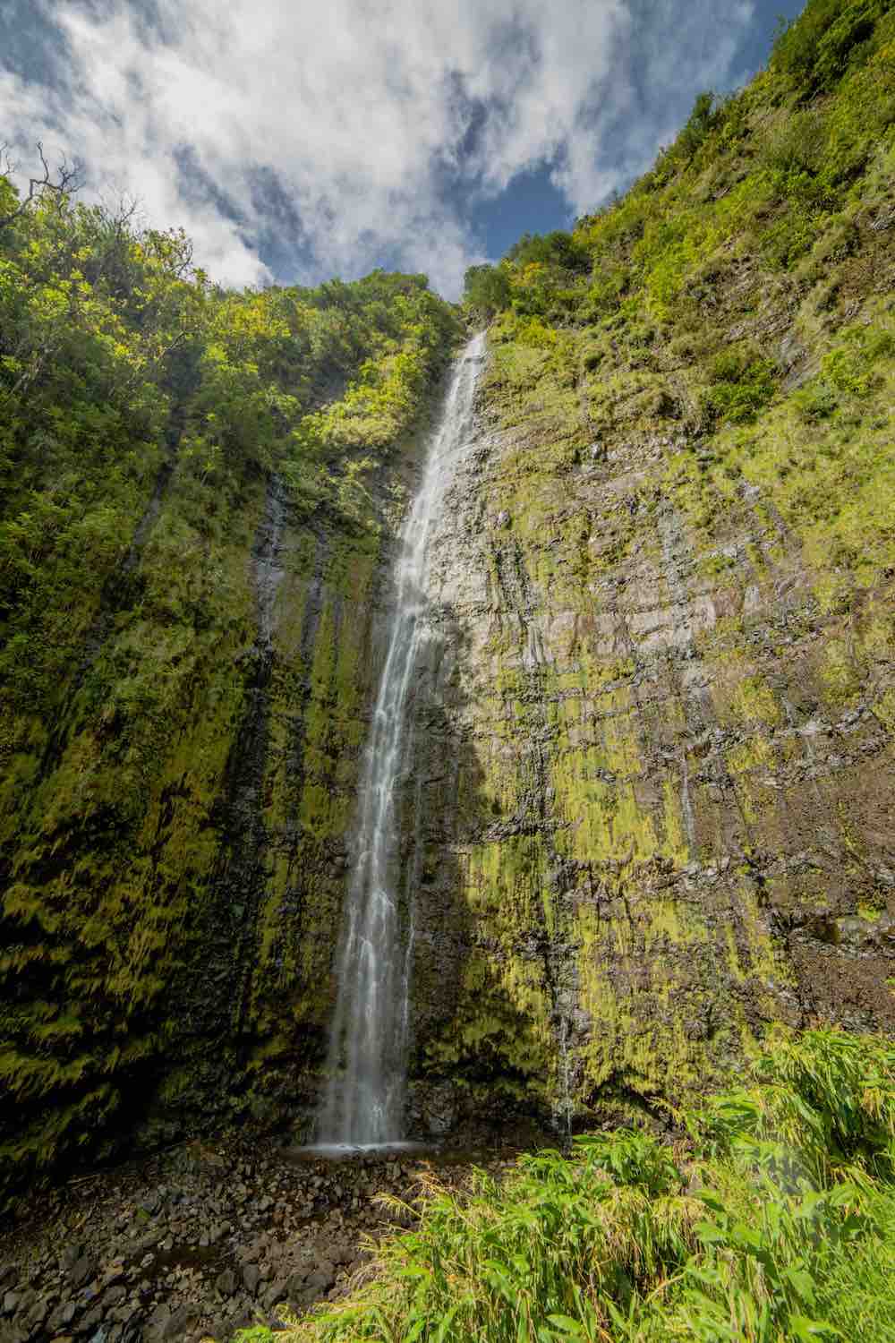 7 Prettiest Best Hawaii Waterfalls to visit featured by top Hawaii blog, Hawaii Travel with Kids: Waimoku Falls is one of the prettiest Maui waterfalls