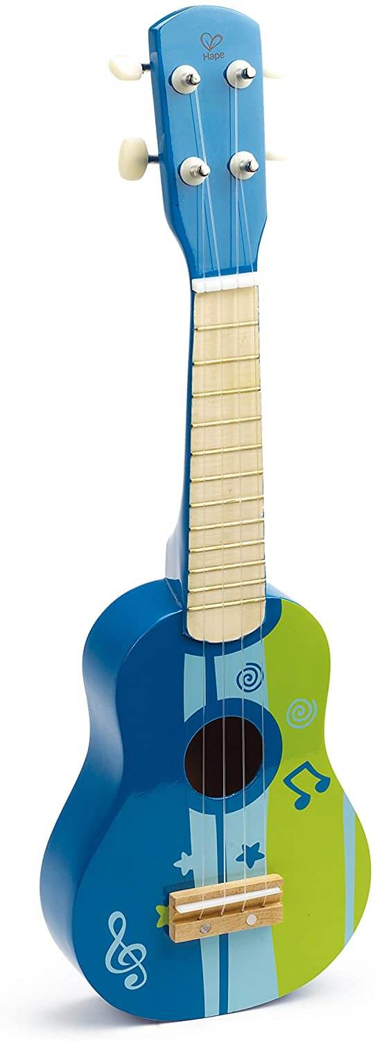 Find out the best toddler ukulele to buy in this ukulele guide by top Hawaii blog Hawaii Travel with Kids. Image of a Hape ukulele