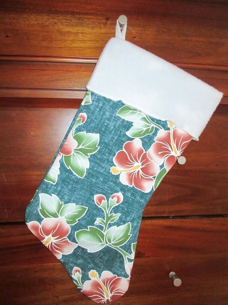 Best Hawaiian Christmas Decorations featured by top Hawaii blogger, Hawaii Travel with Kids: Add some Hawaiian Christmas decorations to your home this holiday season with these top Hawaii Christmas decorations ideas from top Hawaii blog Hawaii Travel with Kids. Image of Hawaiian Print Christmas Stocking